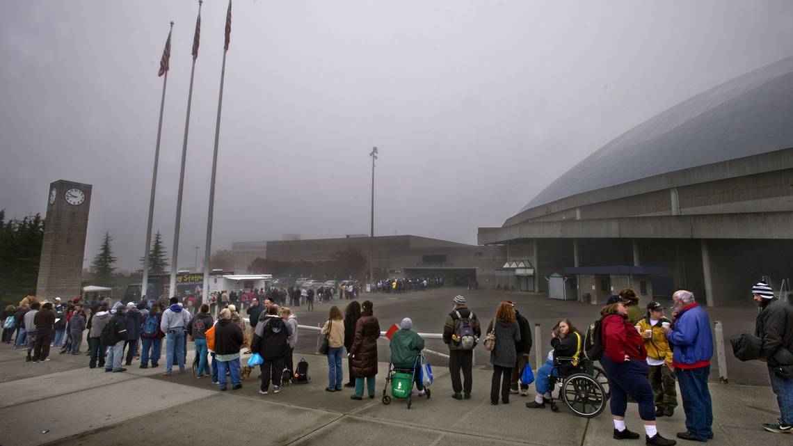 People Standing In Long Line For Affordable Housing In the Fog At Tacoma Washington